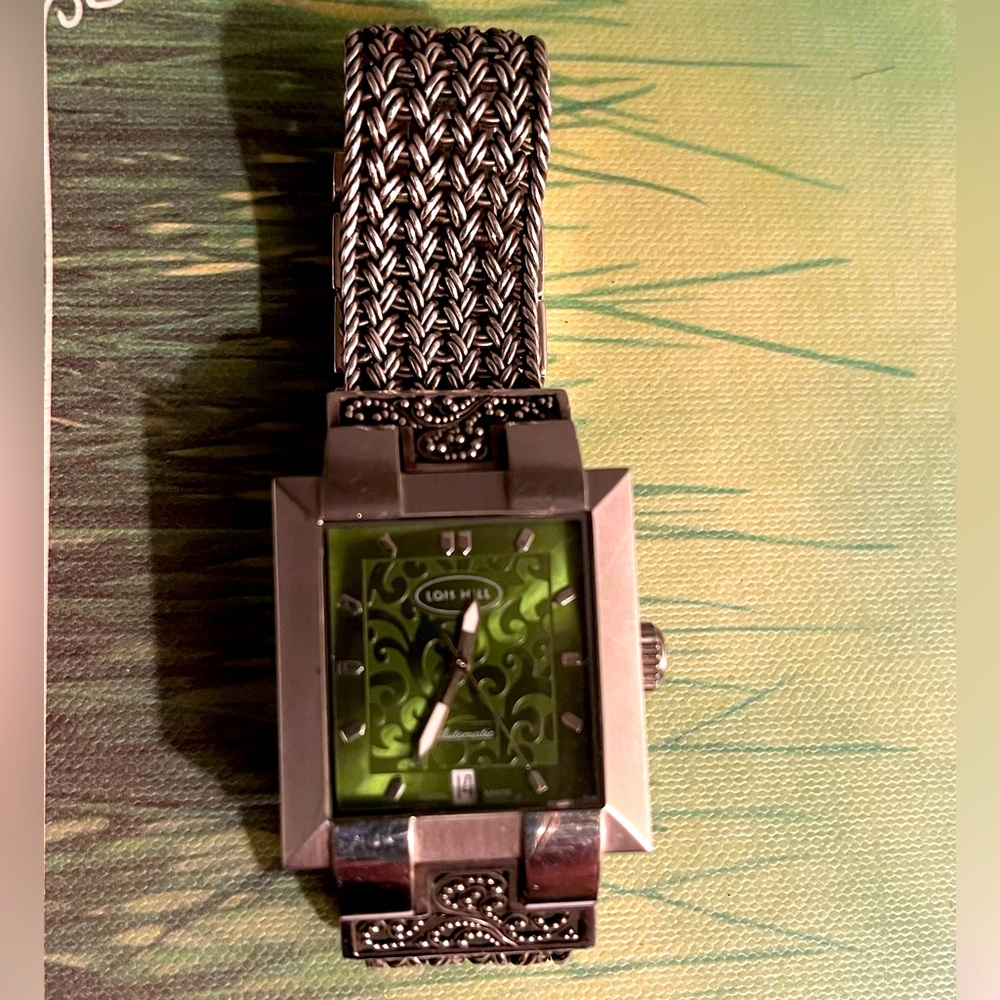 LOIS HILL Sterling Silver Green Dial Watch on a granulated & weave bracelet.